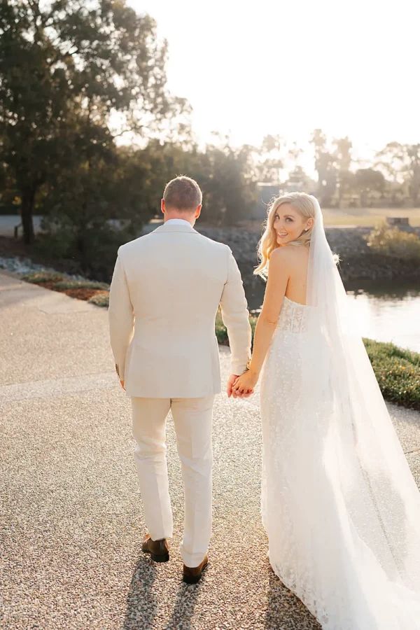 bride looking back at her gold coast wedding photographer