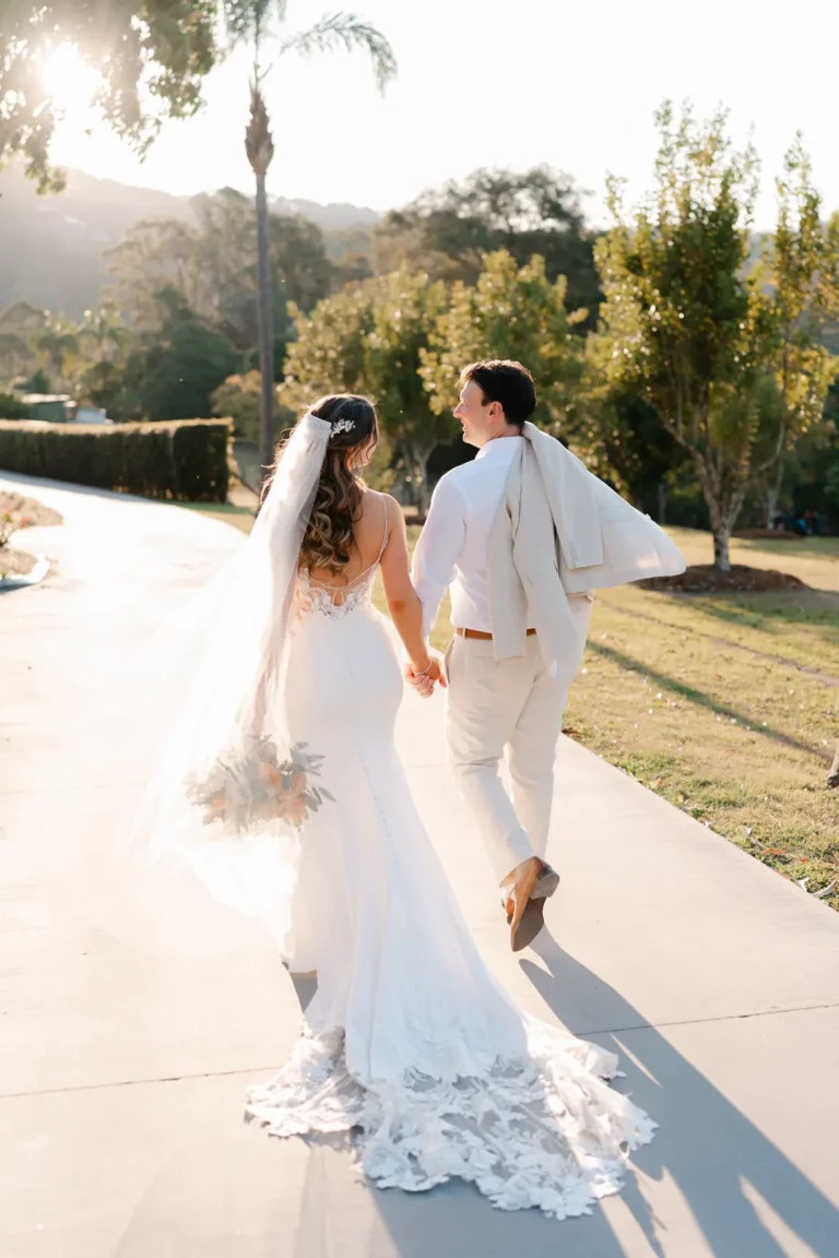 elegant bride and groom walking away at austinvilla estate wedding