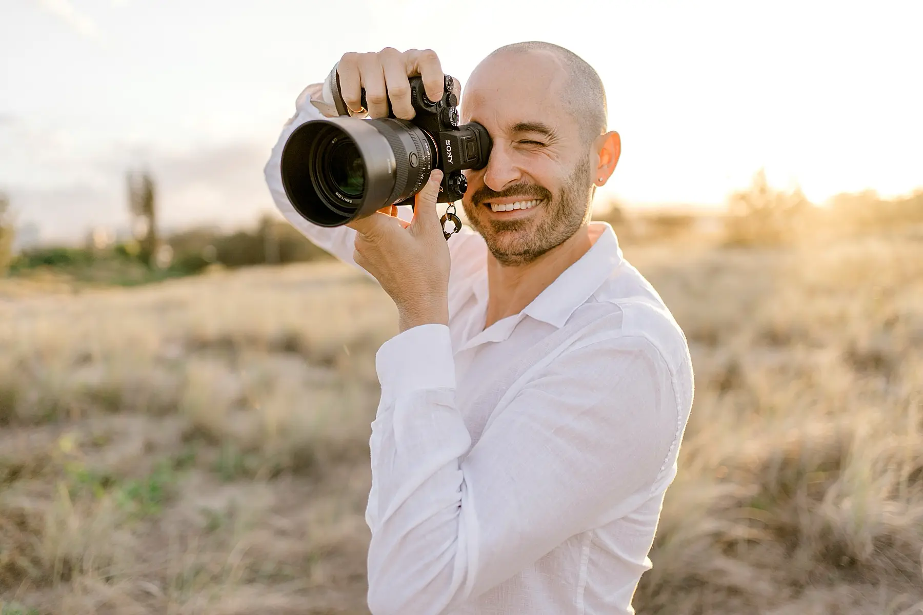mario taking photo with his sony camera and a 50mm 1.2