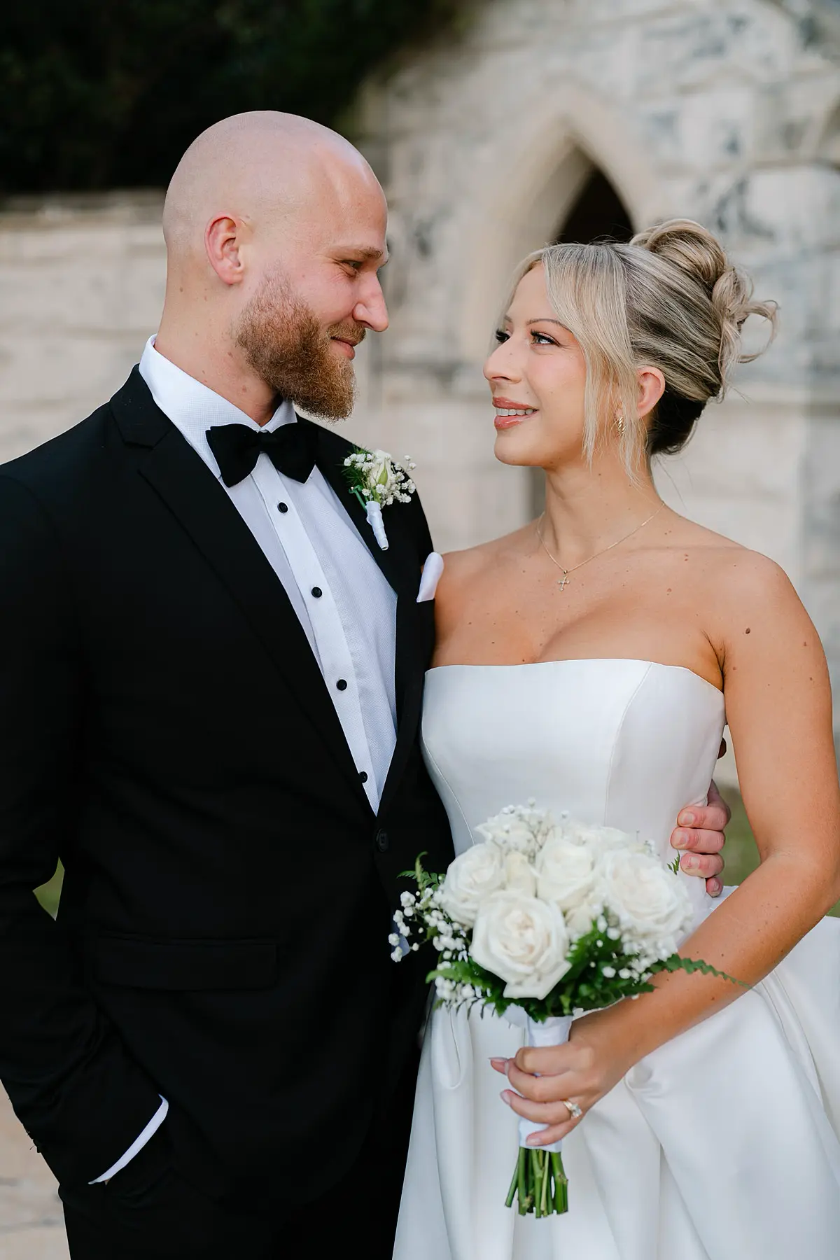 Bride and groom sharing an intimate moment at the evergreen garden venue on the gold coast with a vera wang dress