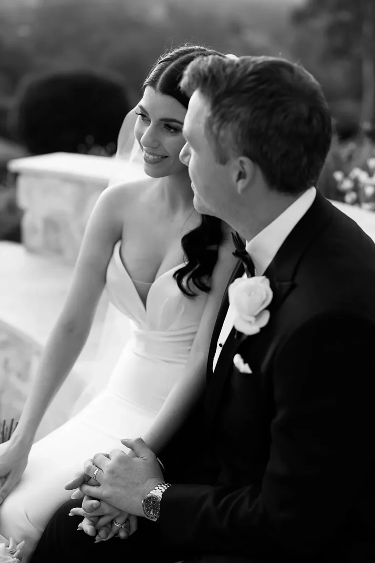 Wedding photo of couple sitting down near fire pit at Austinvilla Estate, a wedding venue on the gold coast