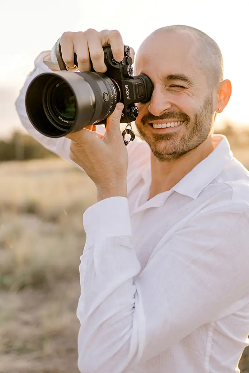 the best gold coast wedding photographer holding a camera